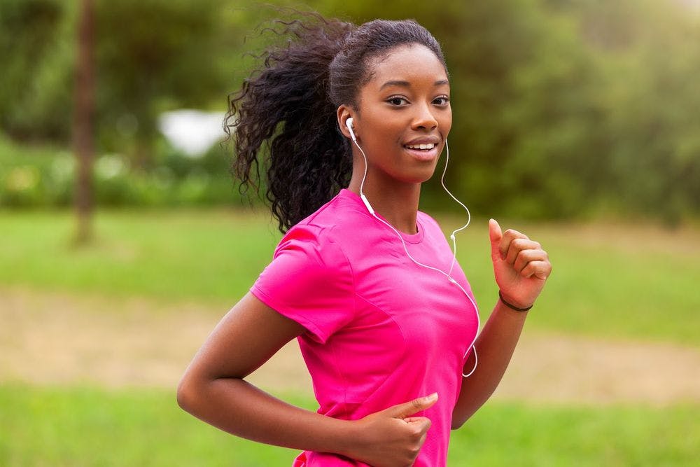 woman looking happy while running 