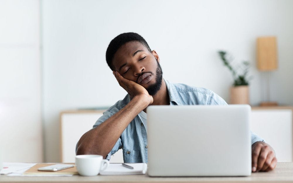 mental fatigue Exhausted African American worker fell asleep at workplace