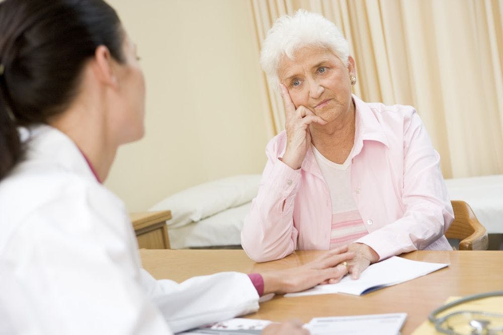 An elderly woman talking to a therapist about her body image 