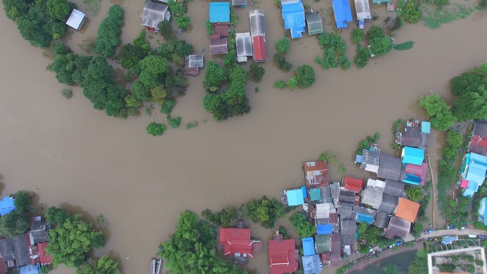 Bird's eye view of flooded homes, natural disaster, ruin