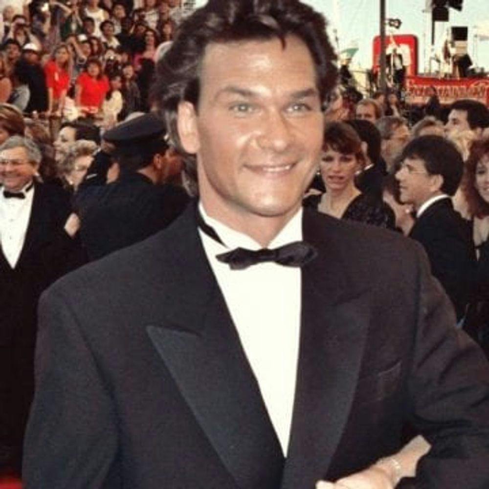 Famous alcoholic Patrick Swayze smiling on red carpet