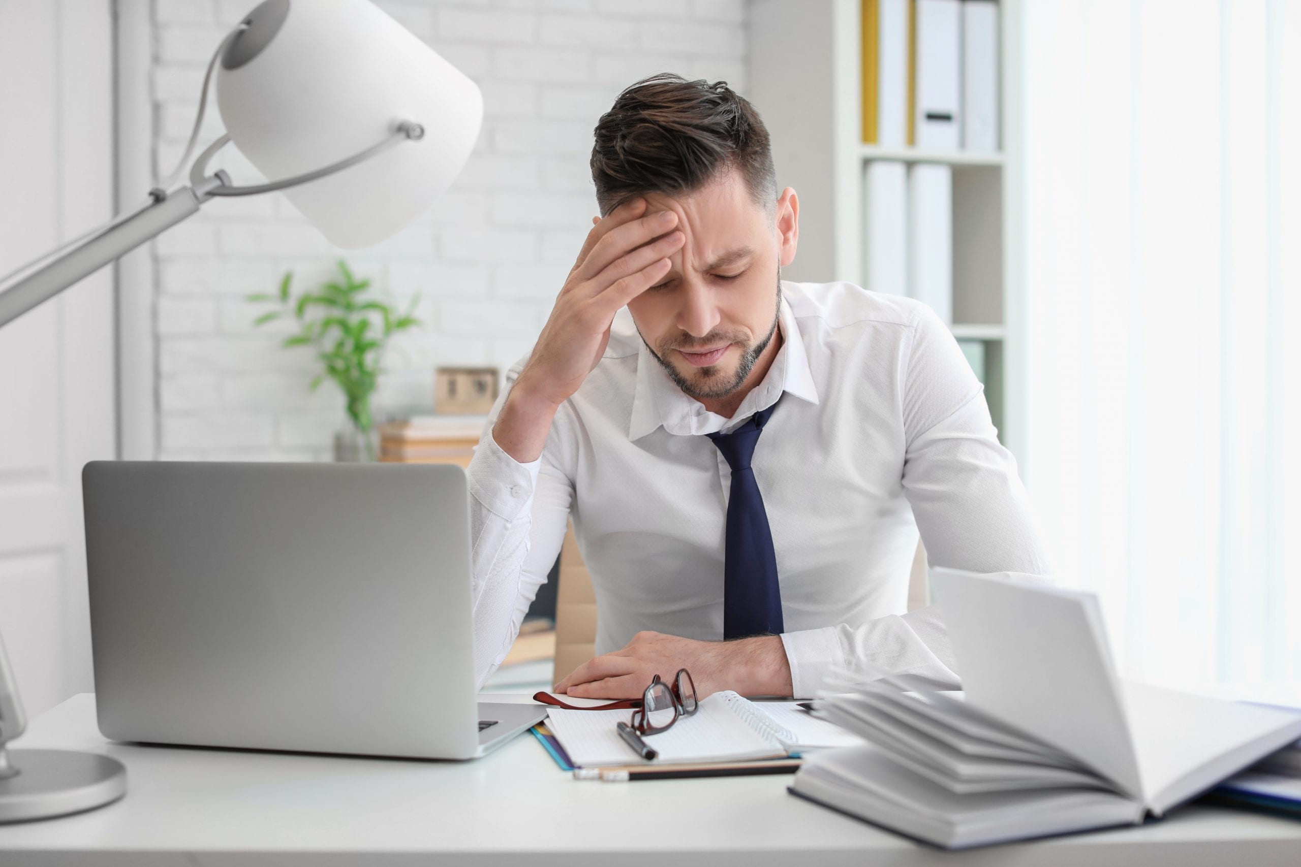 Man suffering from tension headache anxiety
