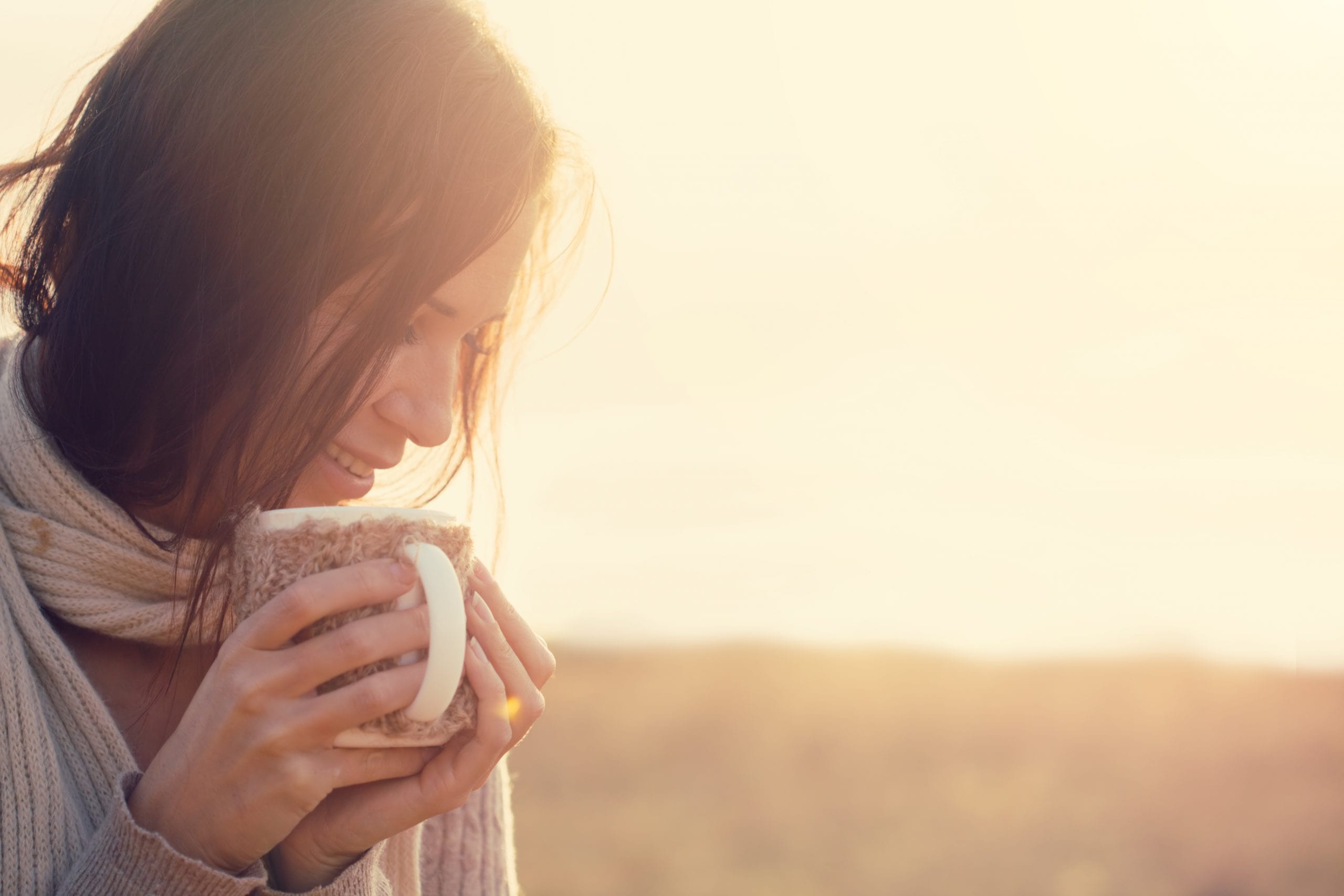Woman holding mug self soothing anxieties away